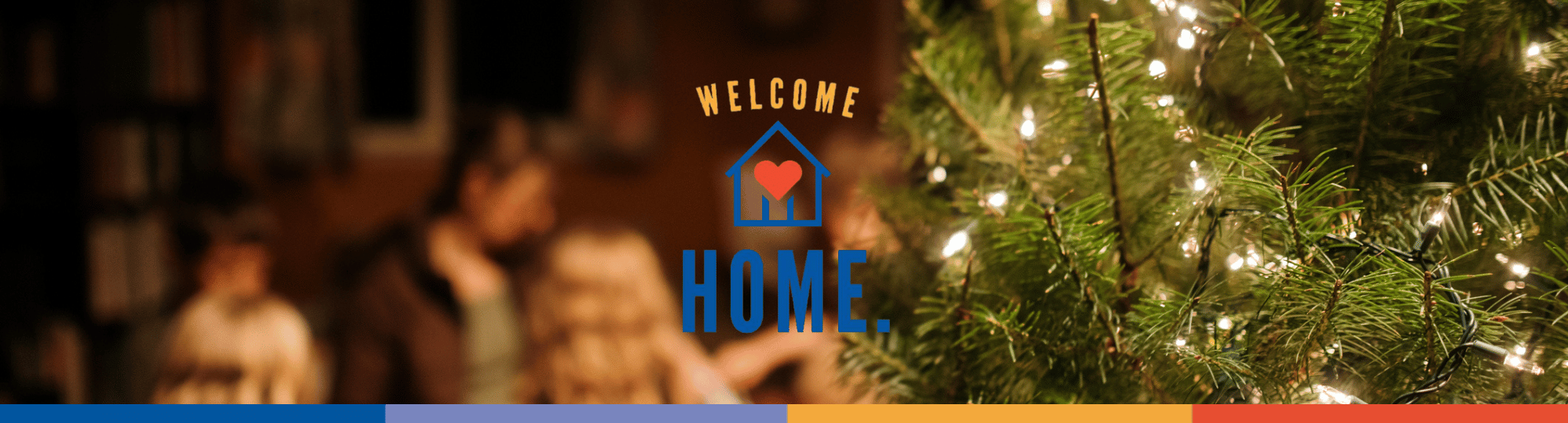 Welcome home kit logo, with an image a family blurred in the background in their home with a lighted pine tree in the foreground to the right